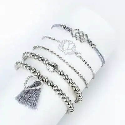Beautiful silver jewelry bracelets featuring beads, charms, and a tassel, perfect for women’s fashion and accessories. Stylish and high-quality silver jewelry from Monalisa Store.