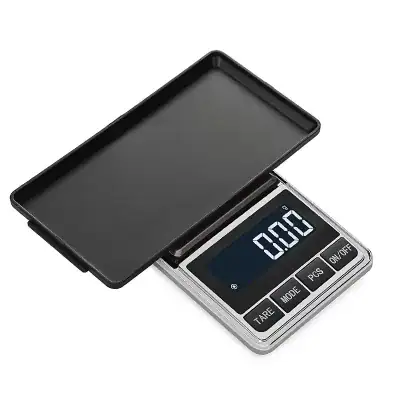Digital electronic precision balance scale for accurate weight measurement in medical and optometry settings.