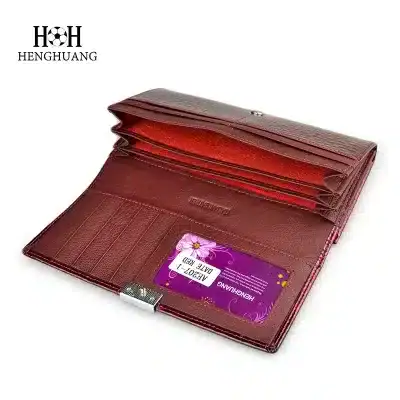 Elegant red leather wallet for storing optical prescriptions, eyeglass cases, and vision accessories. Perfect for eye care professionals and optometrists to organize client eyewear essentials efficiently.