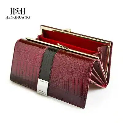Luxury eyewear storage wallet with crocodile pattern, stylish red leather finish, and gold hardware. Designed for convenience and elegance, perfect for organizing sunglasses and optical glasses.