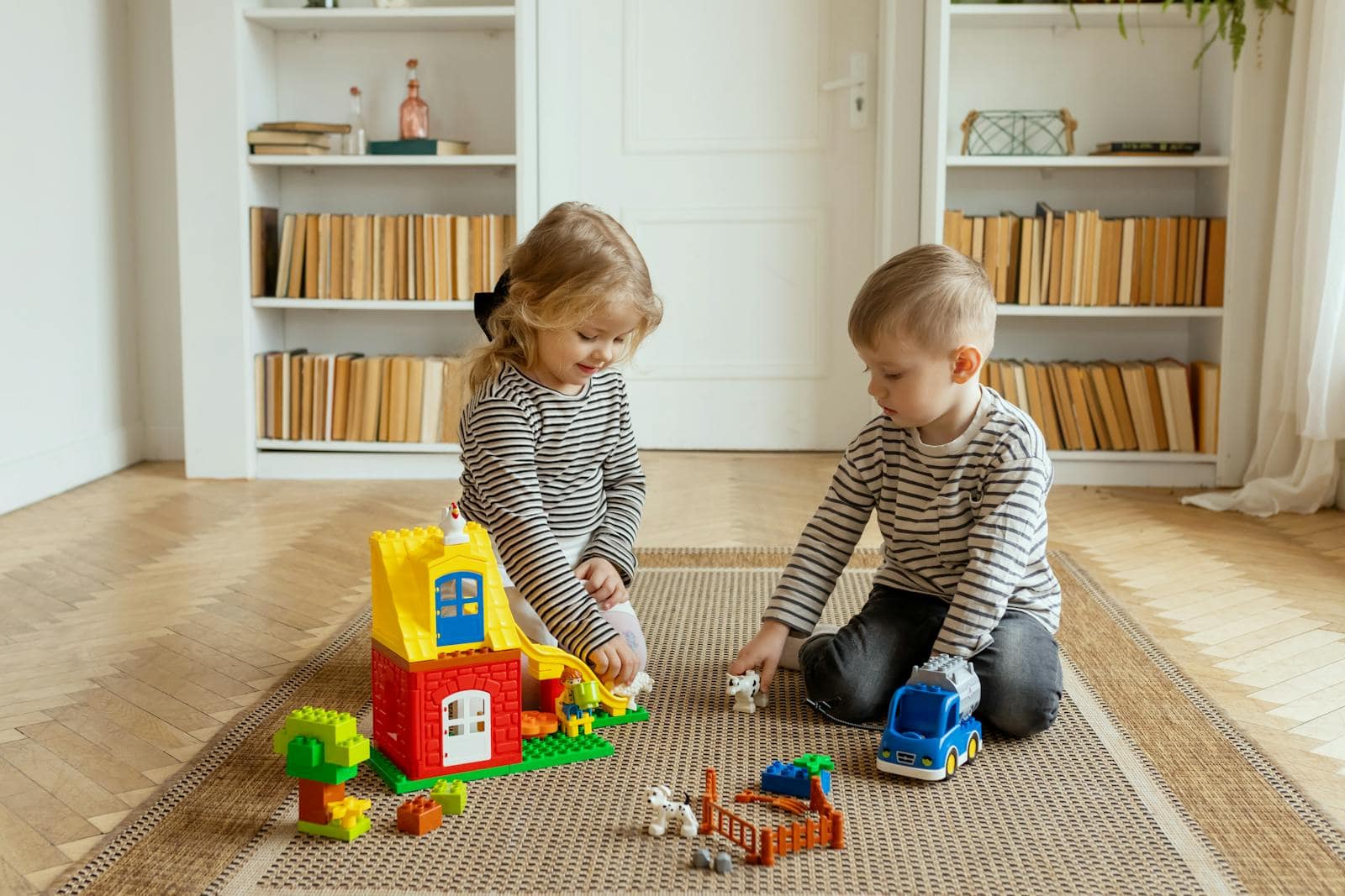 Children Playing with Toys in Room