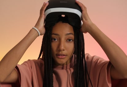 A woman wearing a virtual reality headset, exploring cutting-edge VR technology at Monalisa Store. Perfect for enhancing immersive experiences with premium eyewear options.