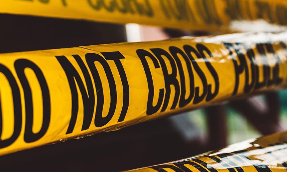 Yellow "Do Not Cross" caution tape used for safety and warning purposes in hazardous areas, construction sites, or crime scenes.