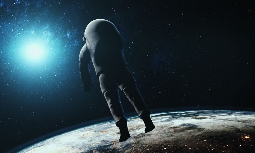Astronaut floating above Earth with starry space background, representing space exploration and advanced technology.