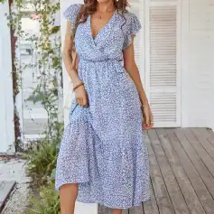 Vibrant blue and white animal print maxi dress with ruffled short sleeves, perfect for summer, casual outings, and beachwear.