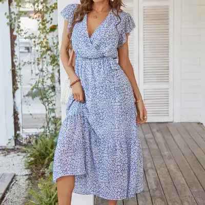 Vibrant blue and white animal print maxi dress with ruffled short sleeves, perfect for summer, casual outings, and beachwear.