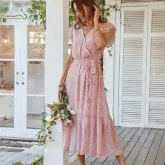 Elegant pink floral maxi dress with ruffled sleeves, perfect for warm weather and outdoor occasions. Features a comfortable elastic waist and flowing skirt for a flattering fit.