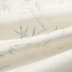 Delicate white wallpaper with subtle bamboo leaf print, perfect for creating a calm, stylish ambiance in living rooms or bedrooms. Ideal for modern interior design accents.