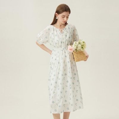 Elegant white floral dress for women with delicate patterns, perfect for casual or special occasions. Made from lightweight, breathable fabric for comfortable all-day wear.