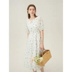 Elegant white summer dress with delicate floral print, perfect for casual outings or special occasions. Made with high-quality fabric for comfort and style.