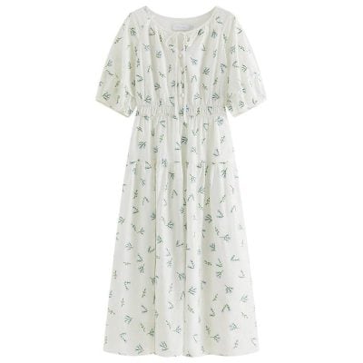 Floral printed dress with puffed sleeves, button details, and a flowy, maxi-length design, ideal for summer and casual occasions. Perfect for a stylish, comfortable look.