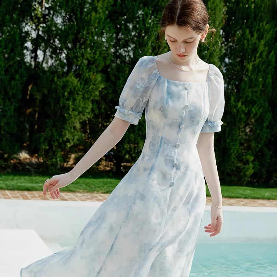 Stylish light blue and white watercolor dress with puff sleeves, perfect for elegant occasions and summer outings. Available at Monalisa Store for fashionable women.