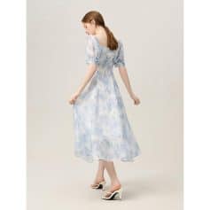 Beautiful women's dress for subtle fashion, ideal for opt shopping or casual outings, featuring a flowy design and pastel blue print. Perfect for those looking to enhance their style with comfortable, stylish clothing.