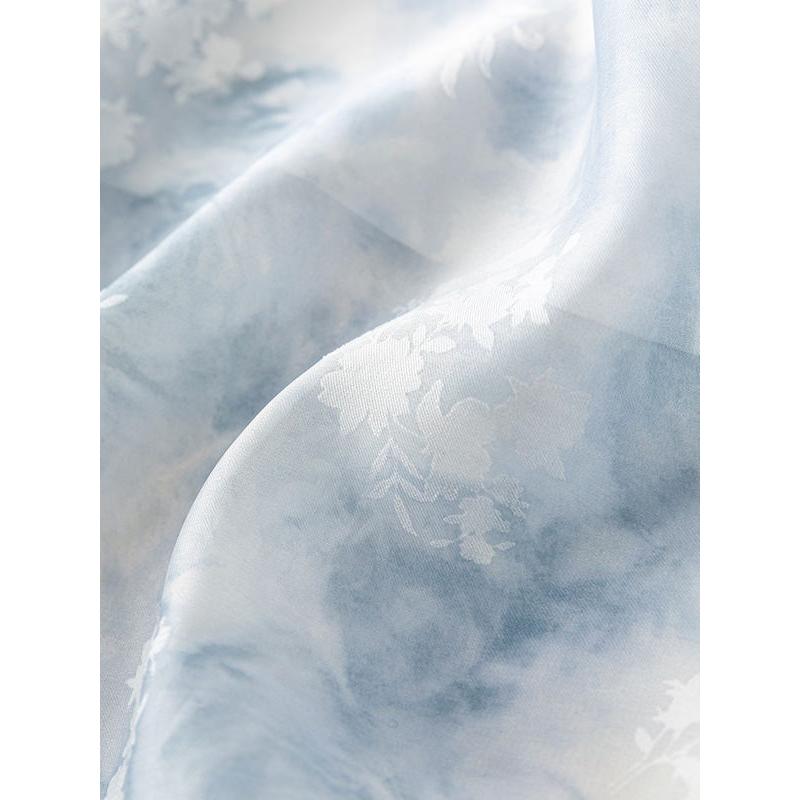 Luxurious satin fabric featuring a delicate floral pattern, perfect for high-end fashion and home decor. Shop elegant textiles at Monalisa Store, your destination for quality fabrics and stylish designs.