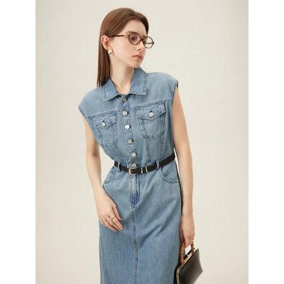 Stylish women's denim dress with sleeveless design, button-up front, and waist belt for a trendy, casual look. Perfect for fashion-forward occasions and everyday wear.