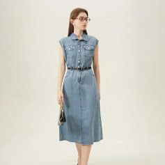 Stylish denim midi dress perfect for optical shop professionals, featuring a sleeveless design with button details and a waist belt for a polished look.