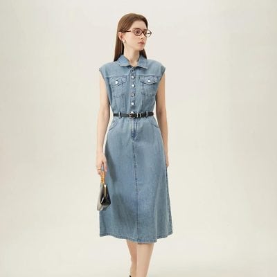 Stylish denim midi dress perfect for optical shop professionals, featuring a sleeveless design with button details and a waist belt for a polished look.