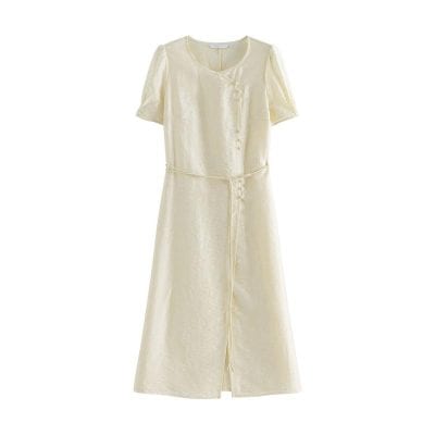 Cream-colored women's dress, featuring a silky texture, short sleeves, and a flowy design perfect for fashion-forward ensembles.