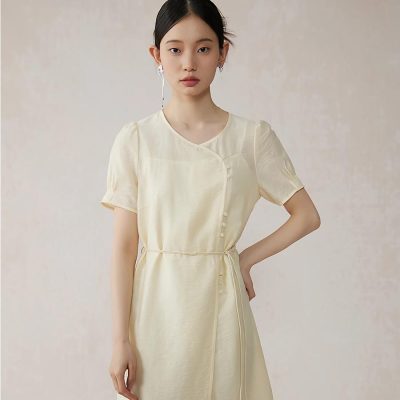 Elegant ivory satin dress with a flattering fit and delicate button details, perfect for formal occasions, stylish events, or office wear. Luxurious and comfortable for all-day elegance.