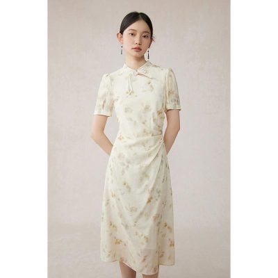 Elegant satin dress with floral pattern, short sleeves, and feminine bow tie detail, perfect for stylish occasions.