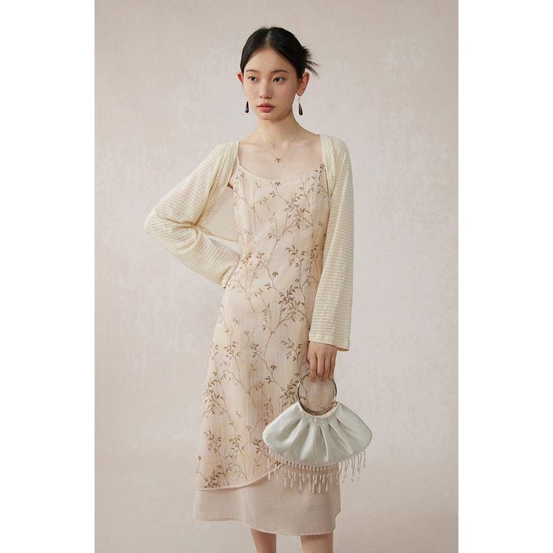 Stylish floral dress paired with a light cardigan, perfect for women seeking trendy and comfortable outfits. Shop now at Monalisa Store for fashionable women's clothing and accessories.