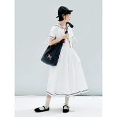 Stylish black tote bag with monogram embroidery, perfect for everyday use and casual outings, featuring durable material and spacious interior for essentials.