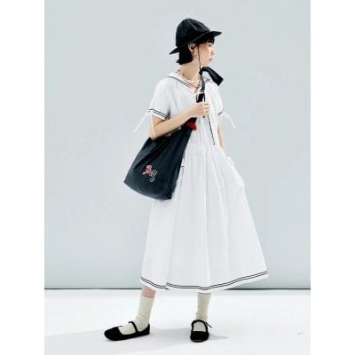 Stylish black tote bag with monogram embroidery, perfect for everyday use and casual outings, featuring durable material and spacious interior for essentials.