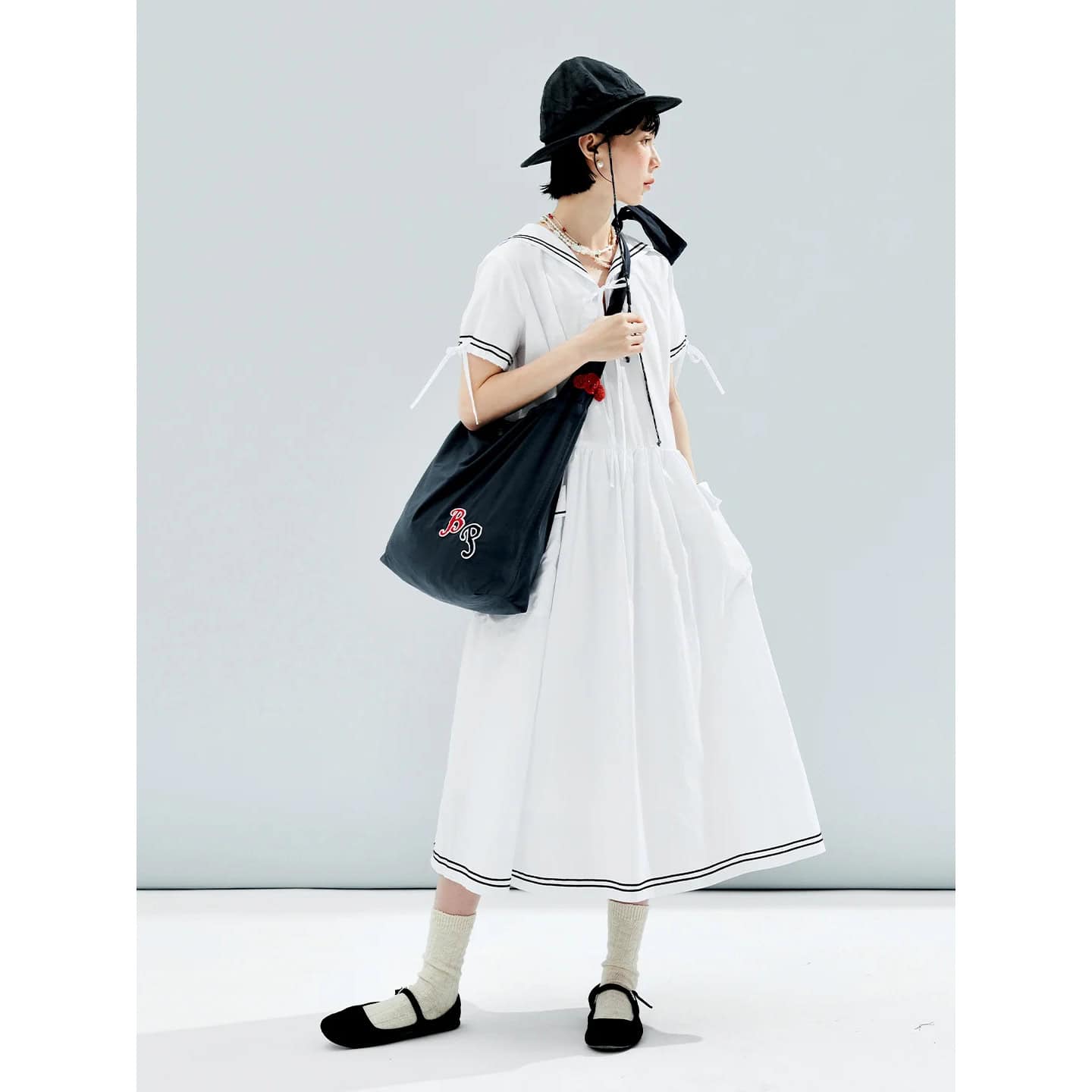 Stylish black tote bag with monogram embroidery, perfect for everyday use and casual outings, featuring durable material and spacious interior for essentials.