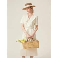 Stylish cream-colored dress with a wide collar and button-down front, perfect for summer outings. Made from high-quality fabric, offering comfort and a chic look.