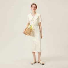 Elegant cream-colored dress with button details and a large collar, perfect for casual or semi-formal occasions, available at Monalisa Medical store.