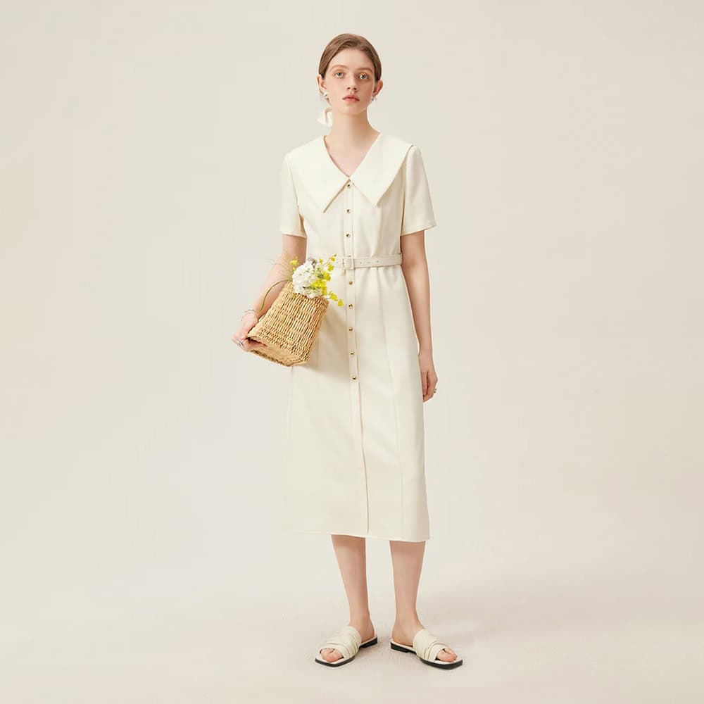 Elegant cream-colored dress with button details and a large collar, perfect for casual or semi-formal occasions, available at Monalisa Medical store.