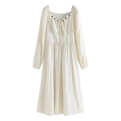 Beautiful white women's dress with long sleeves, gathered waist, and delicate details, perfect for casual or formal occasions.