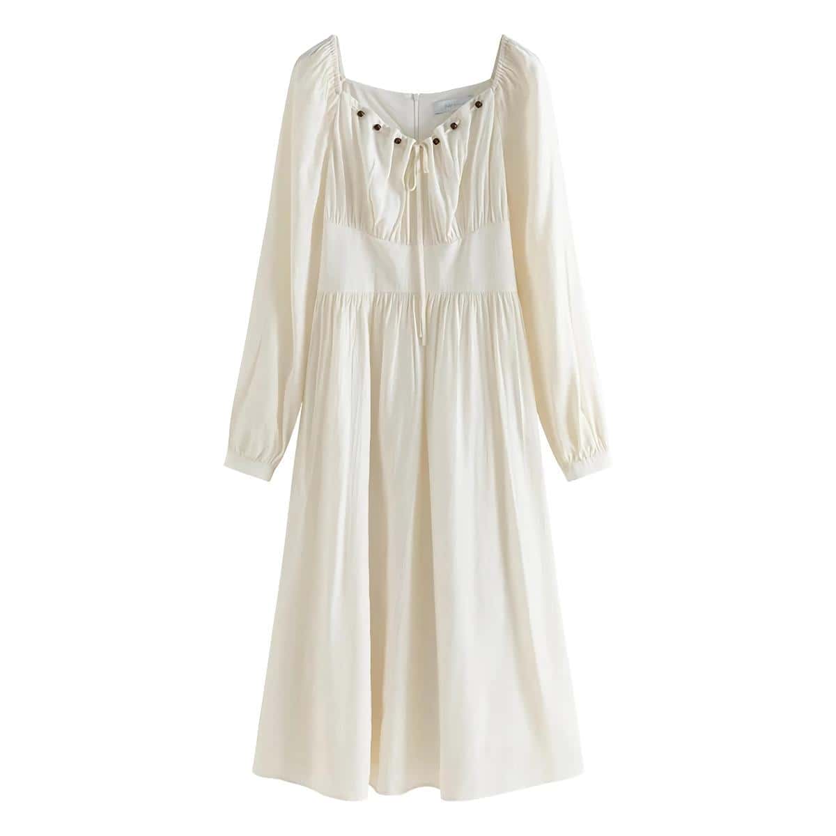 Beautiful white women's dress with long sleeves, gathered waist, and delicate details, perfect for casual or formal occasions.
