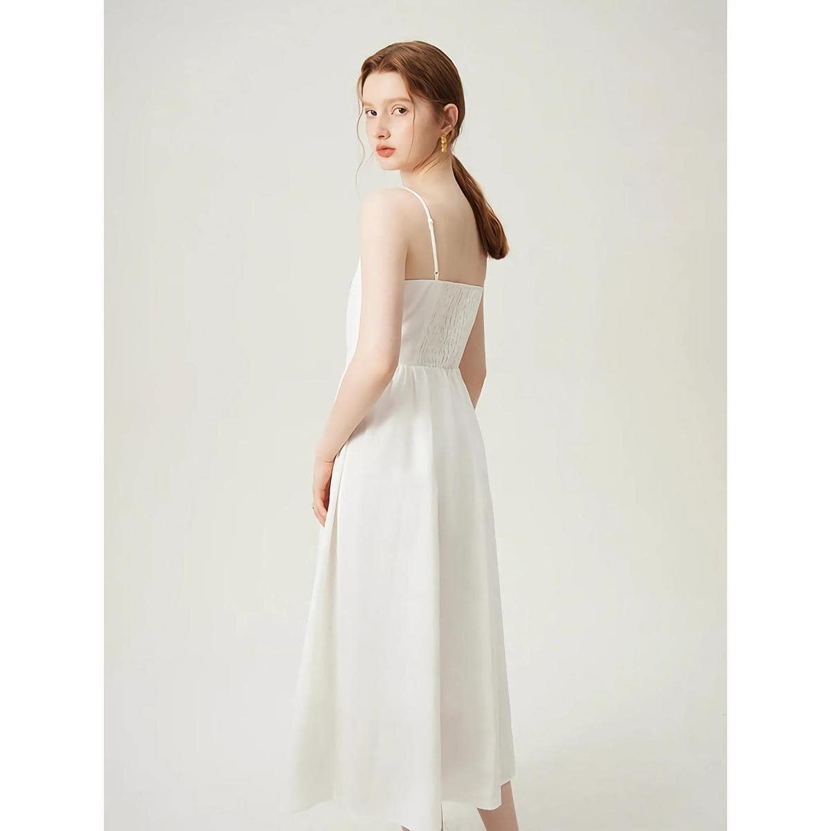 Simple and stylish white dress with spaghetti straps, perfect for summer or special occasions, available at Monalisa Store for fashionable women's clothing.