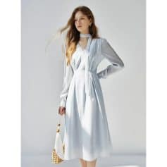 Stylish white midi dress with long sleeves, tie waist, and modern neckline, perfect for professional or casual occasions, emphasizing comfort and sophistication.