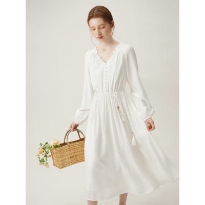 Elegant white long-sleeve dress with a flowy skirt, perfect for casual or semi-formal occasions, from Monalisa Medical Store.