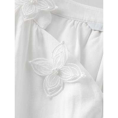 White embroidered medical gown, elegant healthcare apparel with floral embroidery, premium patient care uniform for hospitals and clinics.