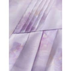 A close-up of lavender-colored medical scrubs fabric with detailed stitching, showcasing soft, durable, and comfortable material suitable for healthcare uniforms and medical dress code.