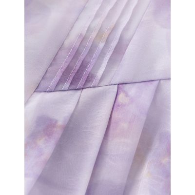 A close-up of lavender-colored medical scrubs fabric with detailed stitching, showcasing soft, durable, and comfortable material suitable for healthcare uniforms and medical dress code.