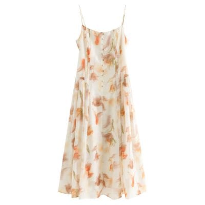 Versatile floral slip dress featuring delicate spaghetti straps, a button-down front, and a flowy A-line silhouette. Ideal for warm weather, casual outings, or beach days. Shop Monalisa Medical.