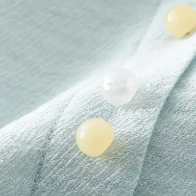 Bright, clean image showcasing premium skincare pearls on textured fabric background, emphasizing luxury and skincare excellence.