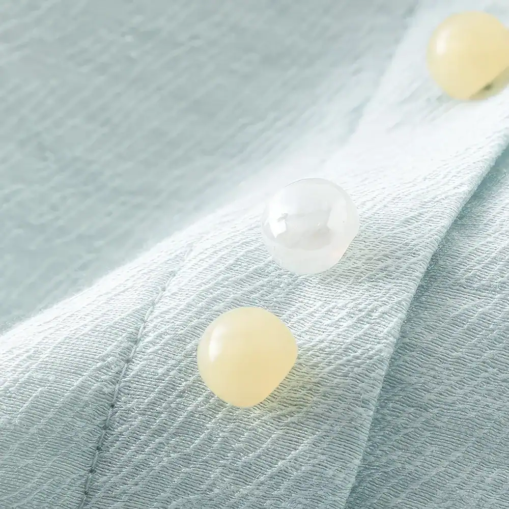 Bright, clean image showcasing premium skincare pearls on textured fabric background, emphasizing luxury and skincare excellence.