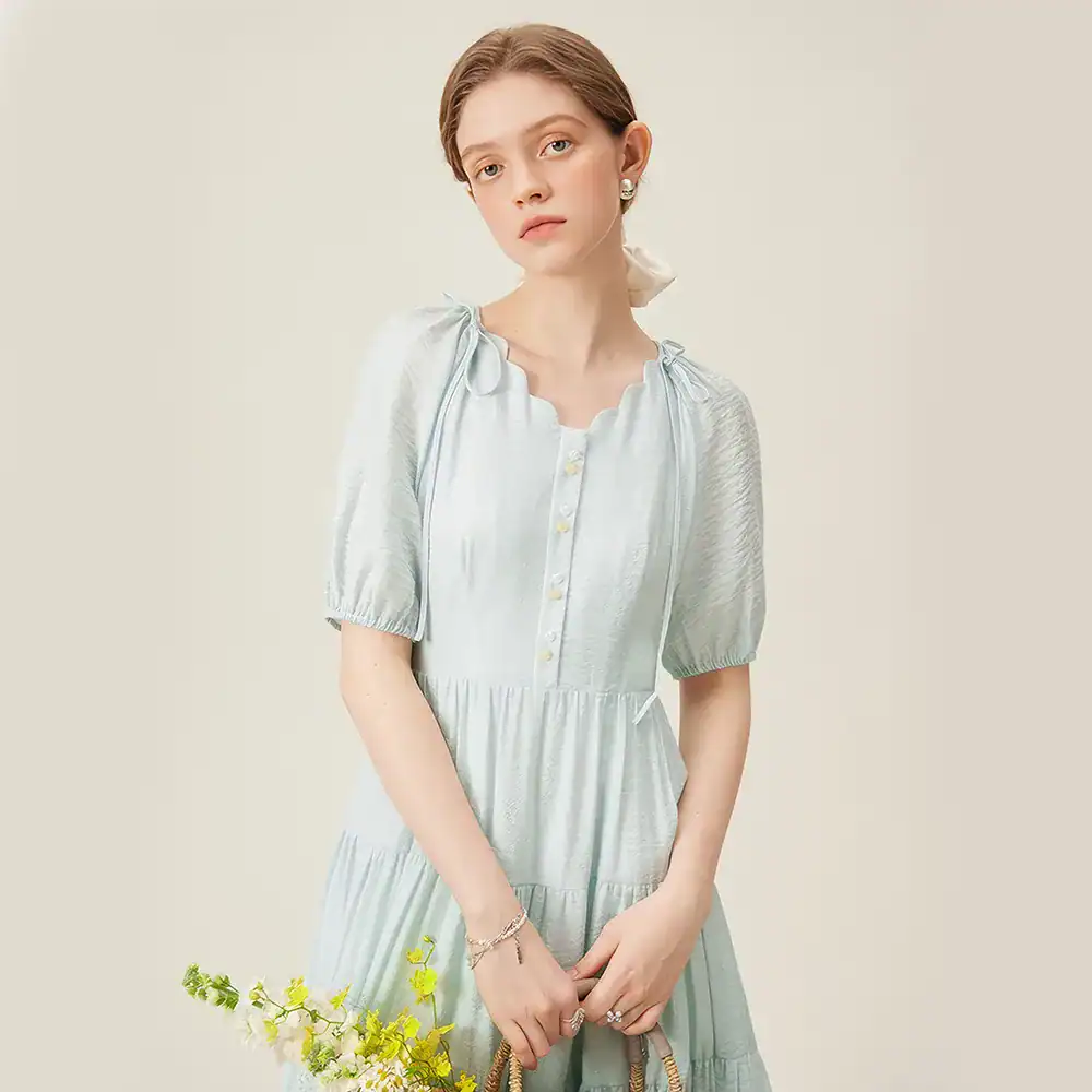 Beautiful women's dress with a soft, silky texture and delicate detailing, perfect for casual or semi-formal occasions, showcasing timeless elegance and modern comfort.