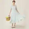 Women’s white flowy summer dress with puff sleeves, button-front detail, and comfortable fit, ideal for casual outings, garden parties, and beachwear, available at Monalisa Store.