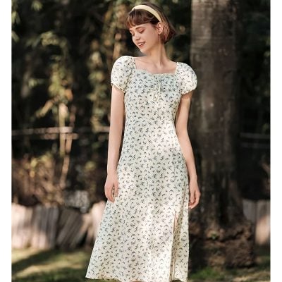 Stylish floral maxi dress with puff sleeves and a side slit, perfect for summer outings or casual events, offering comfort and charm.