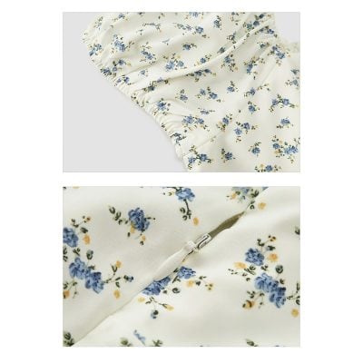 Elegant white dress with blue floral print and zipper closure, perfect for casual and semi-formal occasions. Made of lightweight fabric for comfortable wear, featuring gathered details at the shoulder.