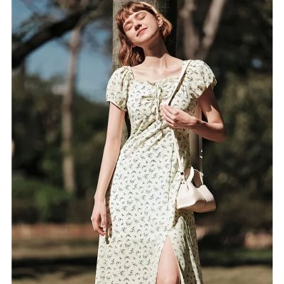 Elegant floral sundress with puff sleeves and slit detail, perfect for warm weather and outdoor outings. Features comfortable fit and stylish design from Monalisa Store.