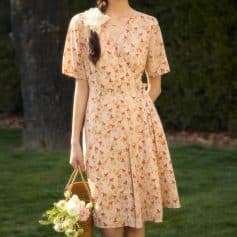 Elegant floral print midi dress for women, perfect for casual outings and garden parties. Features a V-neck and mid-length sleeves for a stylish look.