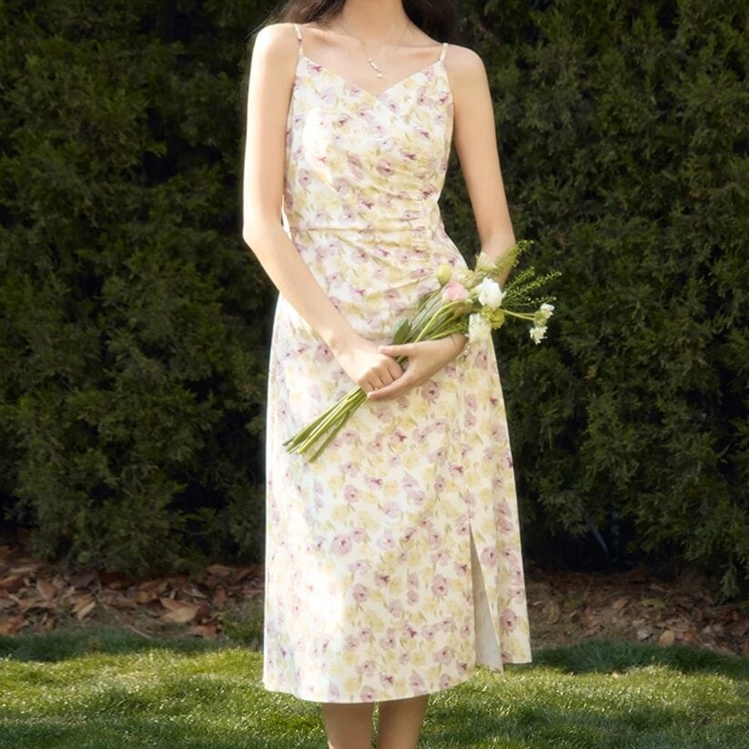 Elegant floral dress, perfect for spring or summer events, showcased by a woman holding a bouquet, emphasizing style and comfort for women.