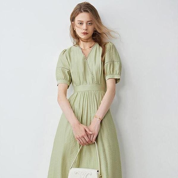 A stylish, light green dress for women featuring a flattering silhouette and comfortable fabric. Perfect for formal events, parties, or casual outings. Elevate your wardrobe with Monalisa Medical's trendy fashion collection.